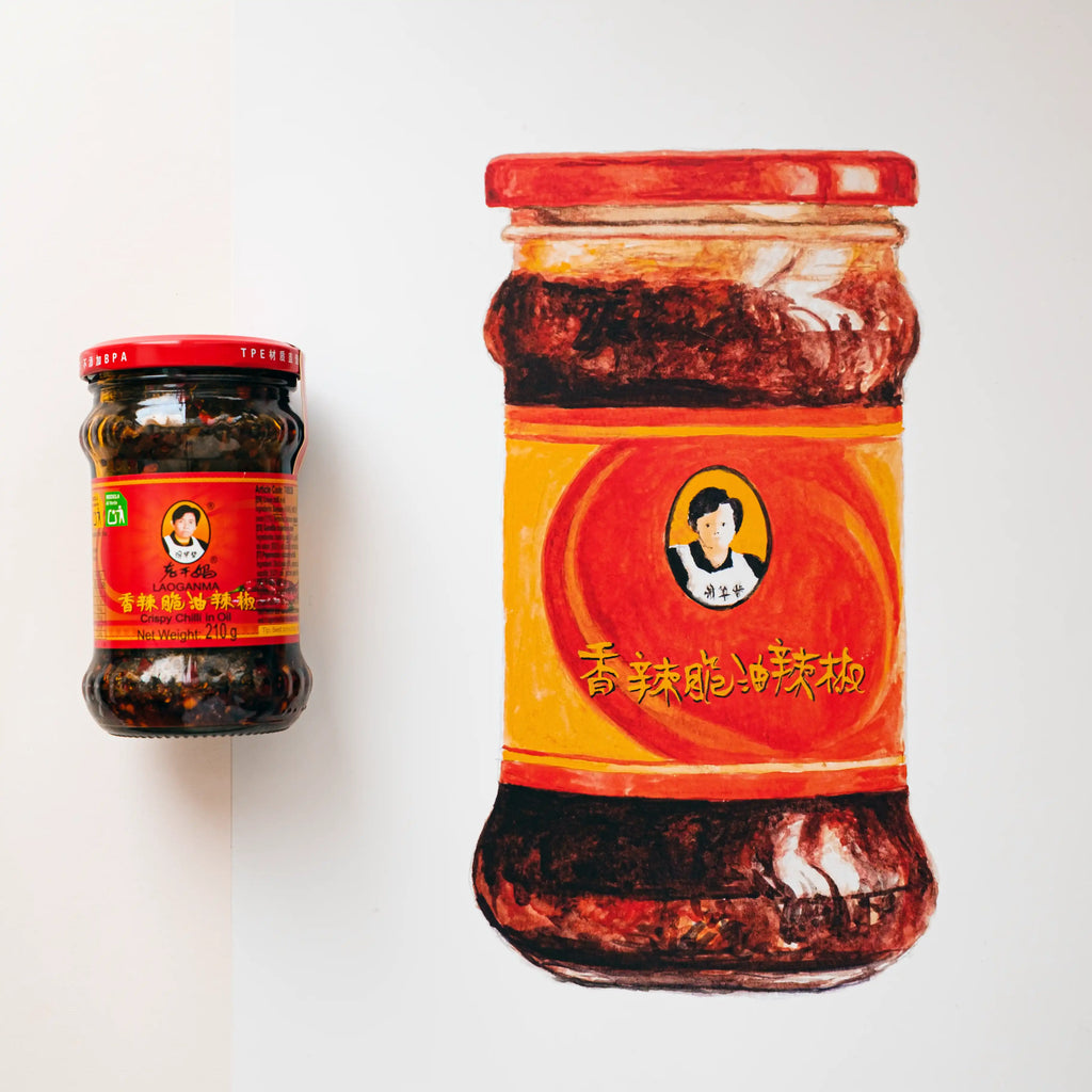 Two jars of a spicy chili product with red labels on a white background