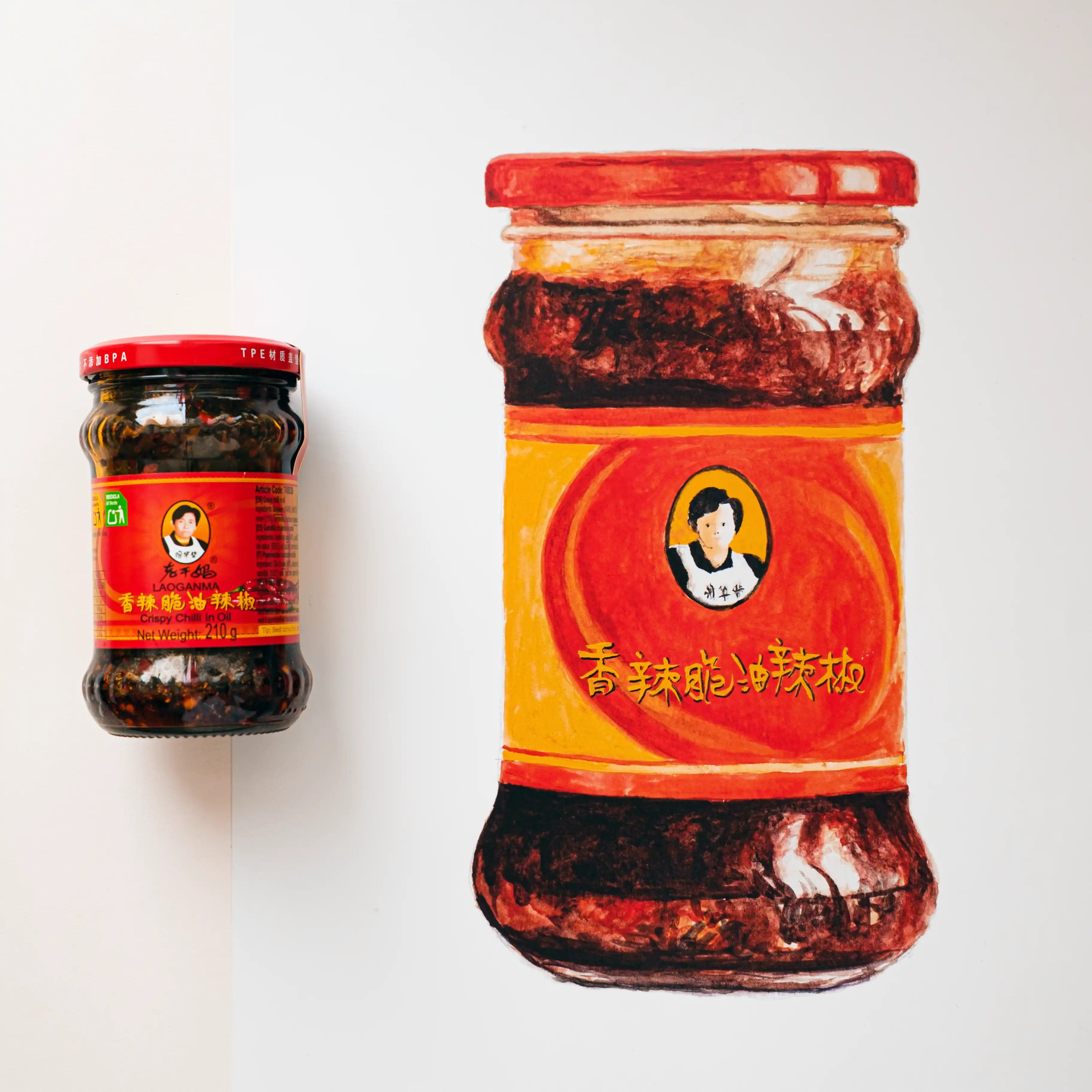 Two jars of a spicy chili product with red labels on a white background