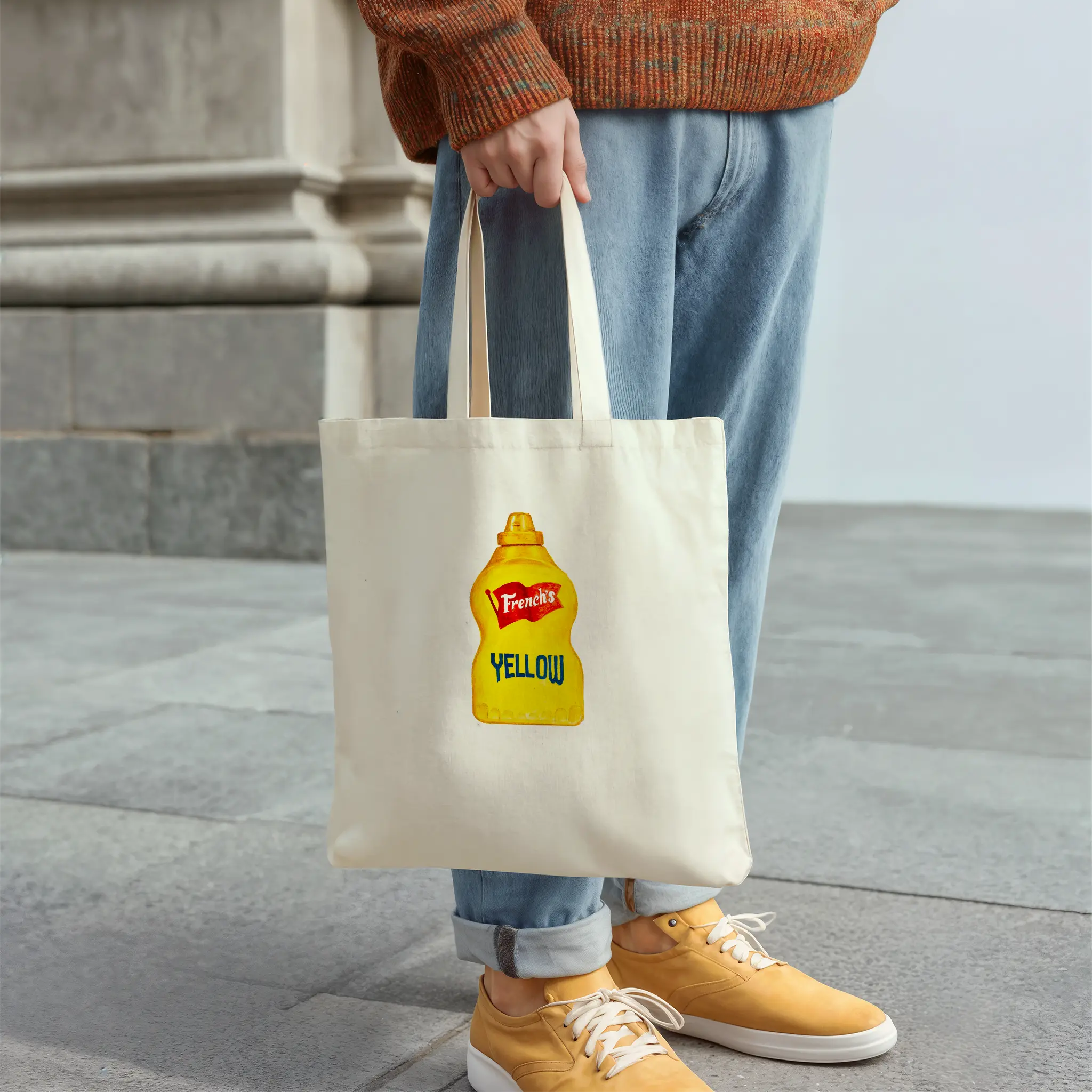 french’s yellow mustard watercolor tote bag, cotton tote bag shown in a flat lay product view