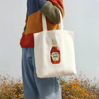 heinz ketchup original watercolor design cotton tote bag shown in a flat lay product view