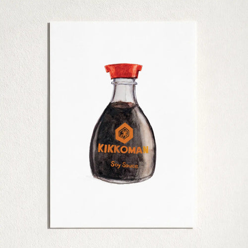 A vertical art print featuring a watercolor illustration of a Kikkoman soy sauce bottle, mounted on a textured white wall.