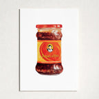 A vertical art print featuring a watercolor-style illustration of a jar of Chinese chili paste, mounted on a textured white wall.