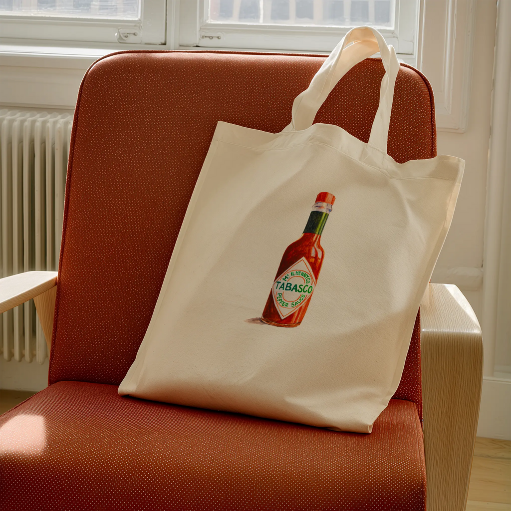 tabasco watercolor illustration cotton tote bag on chair in modern interior