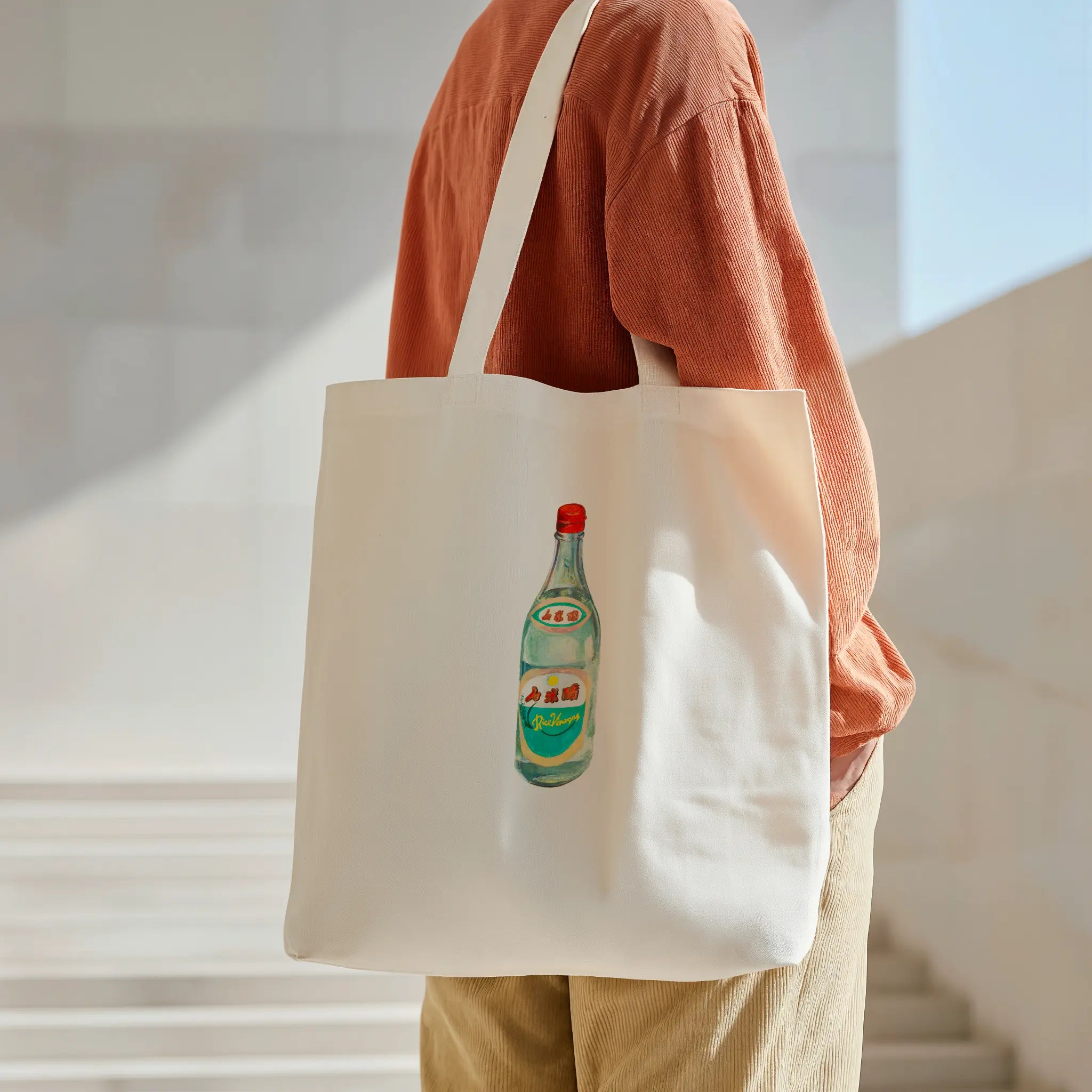 vinegar bottle watercolor illustration cotton tote bag shown in an everyday carry context