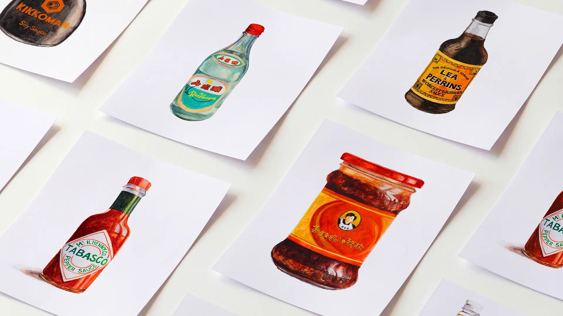 Watercolor food art prints laid flat showing Kikkoman, Tabasco, Heinz, 
Lea & Perrins and Laoganma designs - The Swedish Paintbrush (desktop)